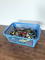 Overall view of basket filled with die-cast cars