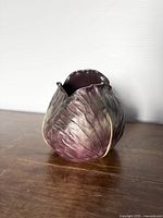 Front angled view of ceramic cabbage planter vase