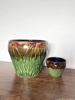 Large and small Sun & Moon drip glaze planters side by side showing full exterior design and size difference