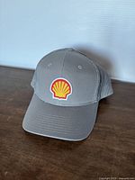 Front view showing Shell logo patch and brim