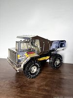 Front left view of Tonka silver anniversary dump truck