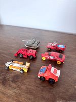 All six Transformers vehicles grouped on tabletop