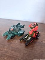 Both transforming figures in vehicle mode side by side