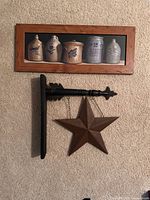 overall view framed print above arrow bracket and star sign