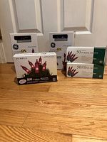 All five boxed sets of purple string lights