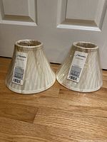 Two sealed J Alexander lampshades front view