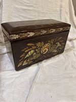 Front and top view of theorem painted wooden box showing stencil design and overall condition