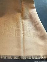 Edge with fringe and visible small mark