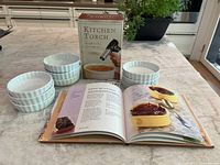 Ramekins, torch box, open cookbook displayed