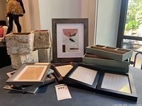 Lot overview showing planters, frames, trays and framed print