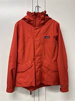 Front view of Patagonia Sidewall jacket hanging, showing full front including hood and pockets