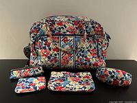 Front view of duffel with four accessories displayed