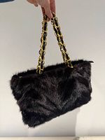 Front view showing black mink fur and chain handles