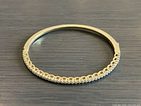 Full view of sterling silver hinged bangle with stone front