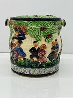 Front view showing relief scene and overall form