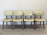 Front view of all four birch dining chairs
