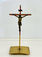 Full view of crucifix showing cross, corpus and base