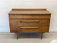 Front angled view showing dresser, pulls and legs