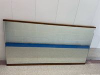 Front view of rectangular birch-framed mirror