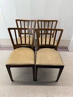Front view of four matching Gelco wooden dining chairs