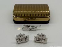 Full set showing cufflinks, tie clip, and box