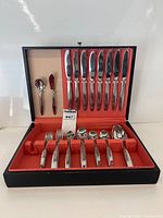 Open case showing full set of utensils