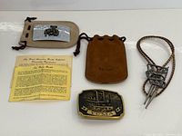 Group shot: Yuma buckle, pouch, leaflet, cowboy buckle, bolo tie