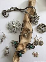 Overview of all jewelry on driftwood