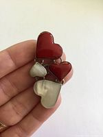 Front view showing four coloured heart inlays