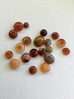 All cabochons spread out showing colour and size variety