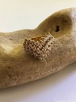 Front view showing V-shaped crystal cluster on vermeil band