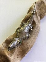 Full view of articulated sterling silver alligator brooch