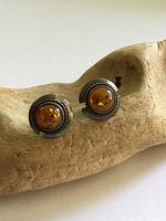 Front view of both amber sterling stud earrings