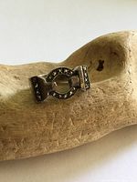 Frontal view of sterling silver ring with marcasite buckle motif