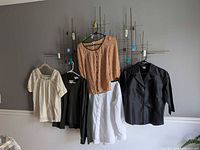 Group shot of all clothing pieces hanging