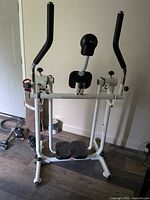 Full view of Fitness Flyer glider showing frame, handlebars, foot platforms