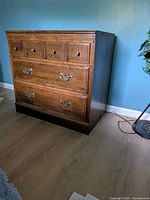 Front view of dresser showing drawer layout and pulls