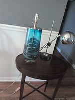 Both lamps on round table showing overall appearance