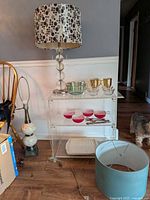 Full lot showing lamp, shades, glassware, bacon tray and silverware