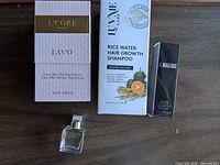 All four boxed items and fragrance bottle