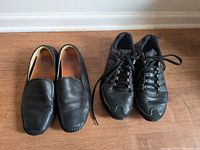 Both pairs of shoes side-by-side: Nike Shox sneakers and 1803 driving loafers