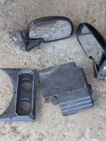 Two black side mirrors, honeycomb grille insert, black plastic cover