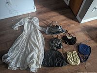 overall lot showing lace gown and six purses