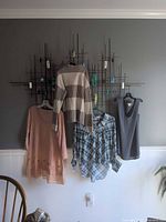 Four tops hung side by side showing overall styles and colors