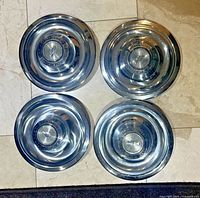 All four Chevrolet rally wheel center caps front view