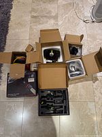 All four boxed auto parts in foam packaging plus LED bulb kit and wiring set visible