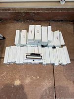 Stack of boxed LED light bars with one unboxed unit displayed