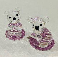 Front view of Swarovski crystal bear and koala figurines