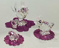 Group shot of rooster, hen and two chicks on purple pads