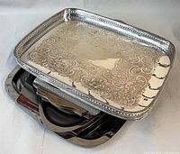Stacked view showing silver-plated tray atop stainless trays